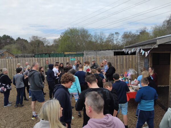 Learners, families and staff at The Stable School Easter Fayre in Christchurch, enjoying the community raffle.