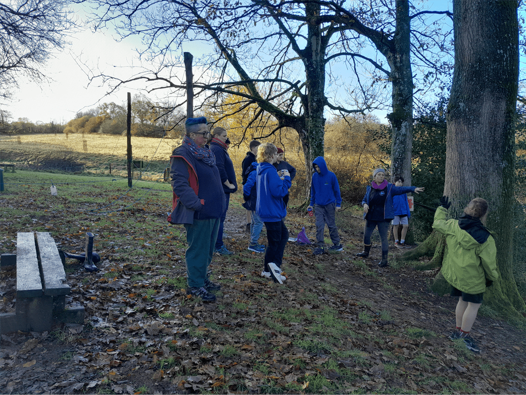 Magdalen Farm staff explaining the low-ropes course to Highgate learners and staff from The Stable School.