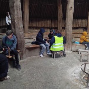 Stable School learners from Waikiki and Fistral classes taking part in hands-on historical activities at the Ancient Technology Centre in Cranborne, exploring ancient farming and building techniques.