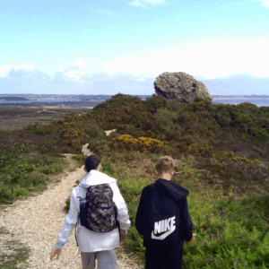Year 9 and Year 10 learners from The Stable School visit Agglestone Rock in the Purbecks during an educational trip exploring Dorset’s natural landmarks and coastline.