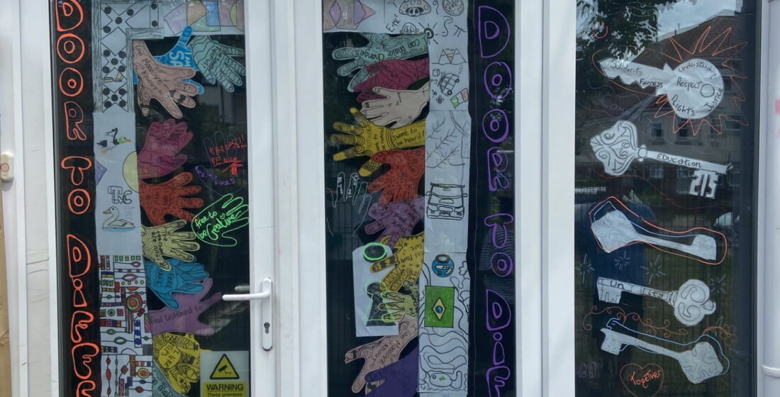 Colourful handprints, decorated keys and positive messages come together to showcase inclusion and belonging at The Stable School's EDI installation.